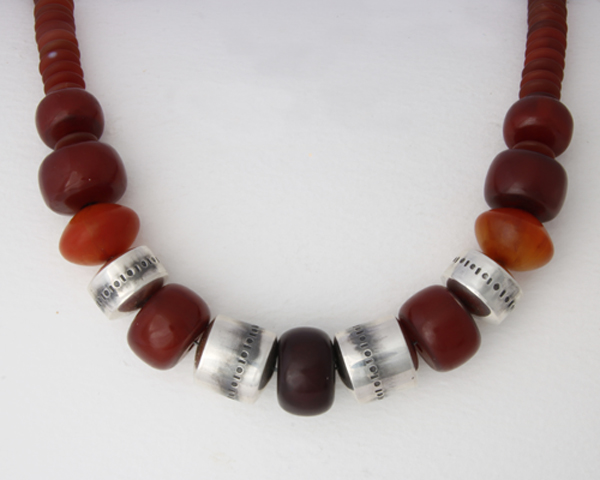 Large necklace with handmade silver beads, reclaimed Copal beads and cornelian rondelles beads.